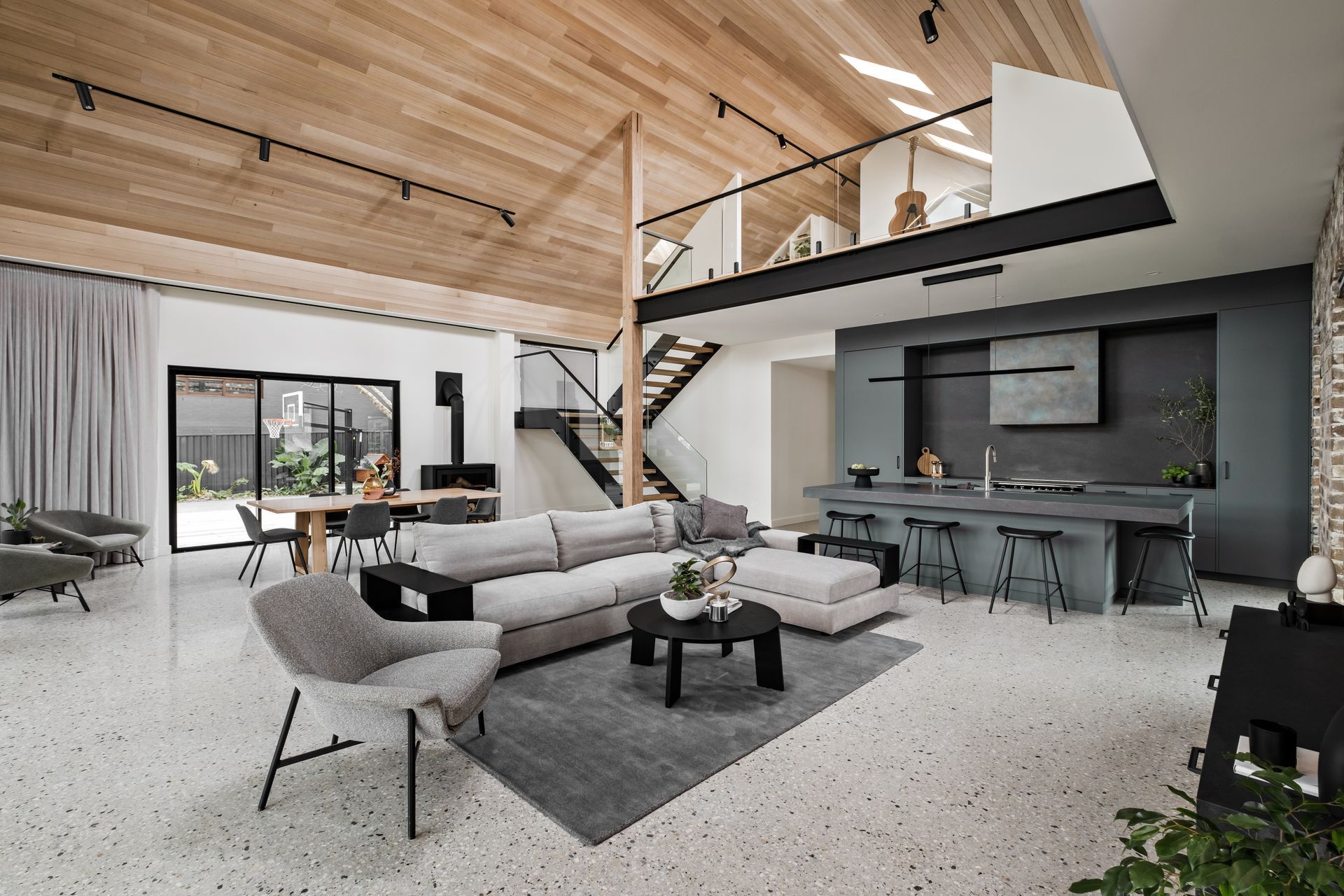 A wide central hallway downstairs leads to the boys' bedrooms and master suite, while upstairs the teenage retreat s open and airy.