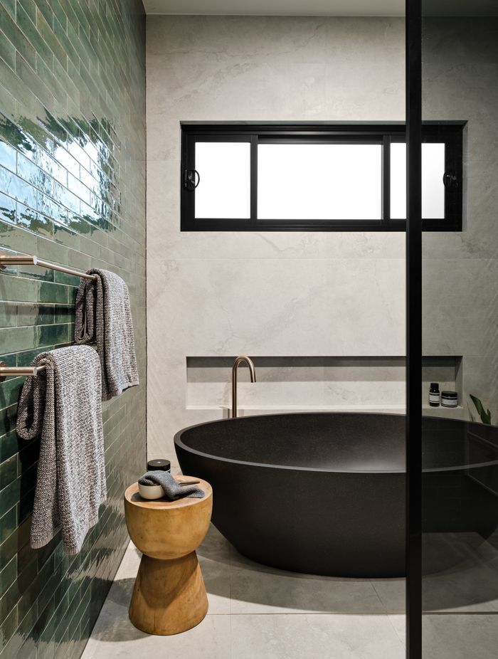 The beautiful black stone bath is a feature of the family bathroom.