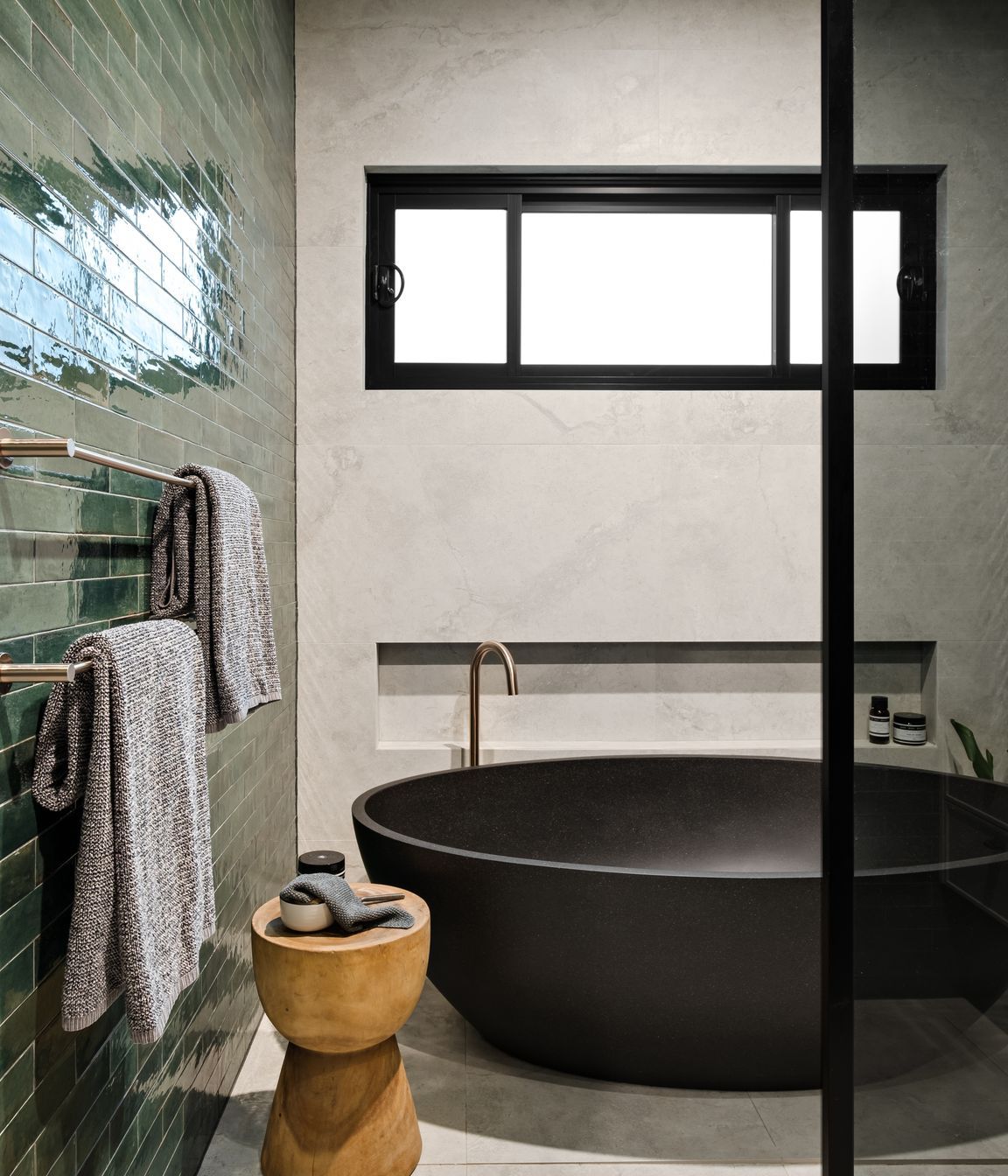 The beautiful black stone bath is a feature of the family bathroom.