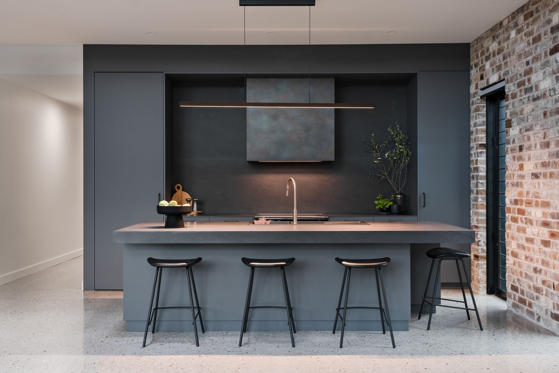 A butler's pantry behind the kitchen means the kitchen remains uncluttered.