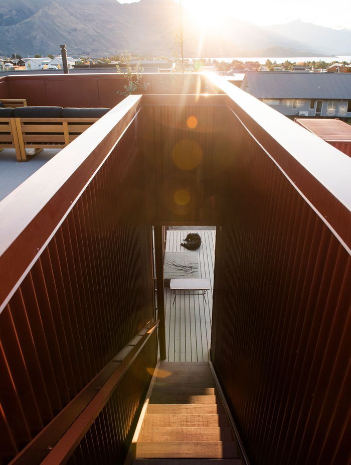 The decking around the house is Abodo Wood.