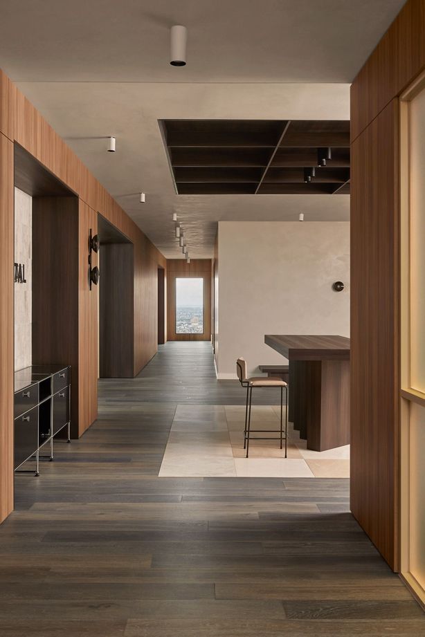 Contrasting timber tones add interest to the muted palette.
