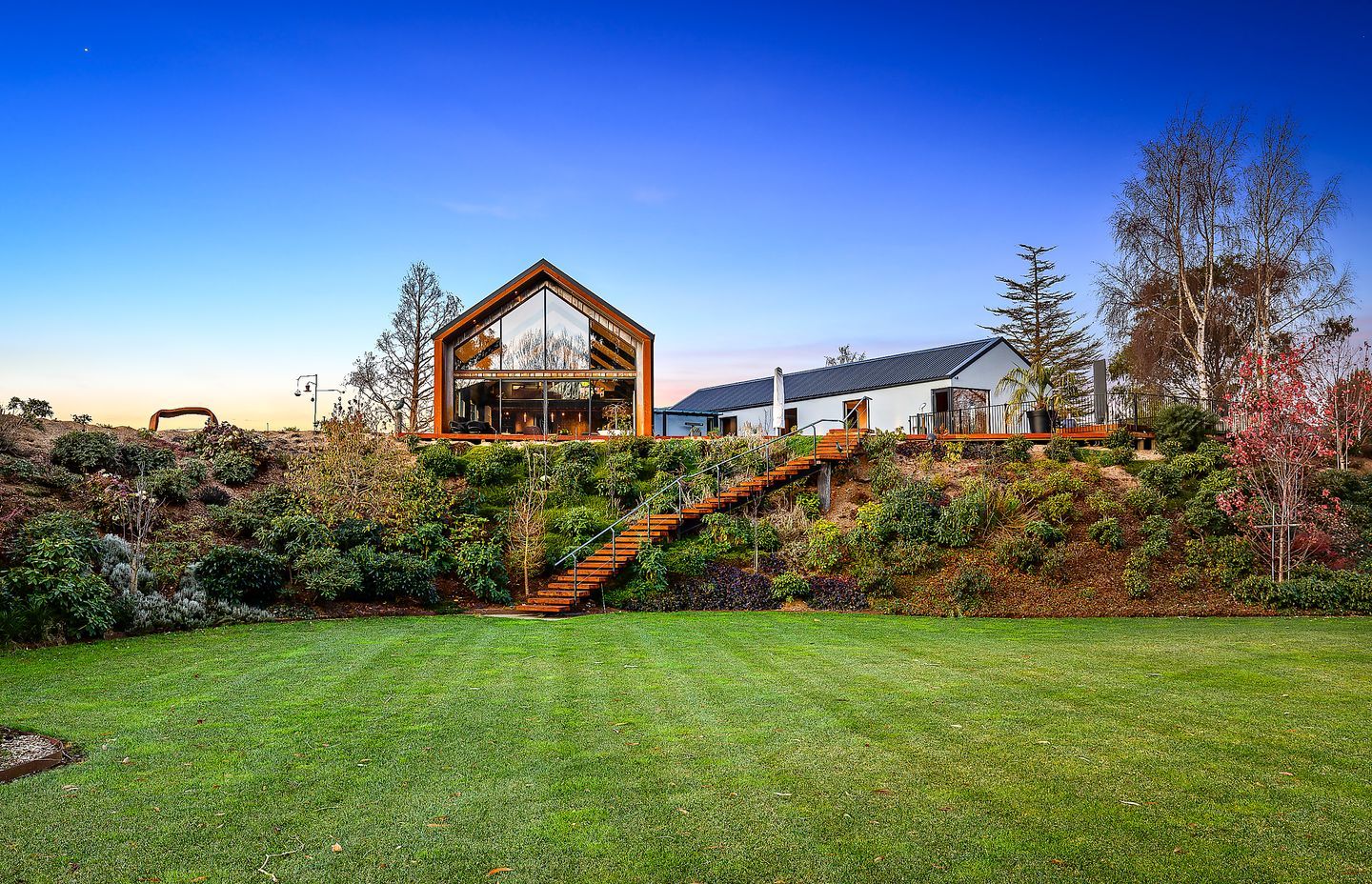 The home overlooks the established gardens on the property.