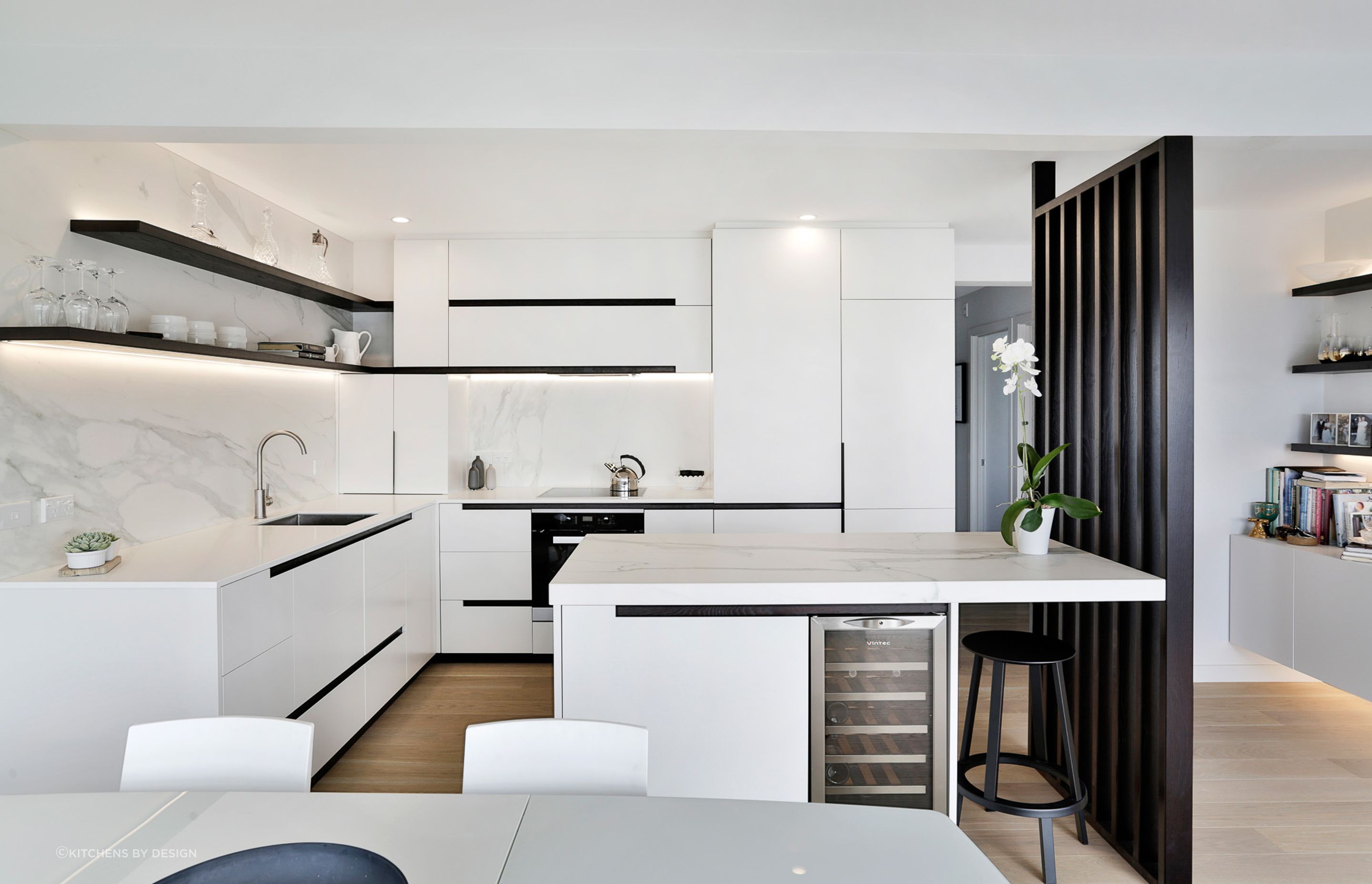 This sophisticated kitchen in Mission Bay by Kitchens by Design shows how the colour scheme can make a space feel light and fresh.