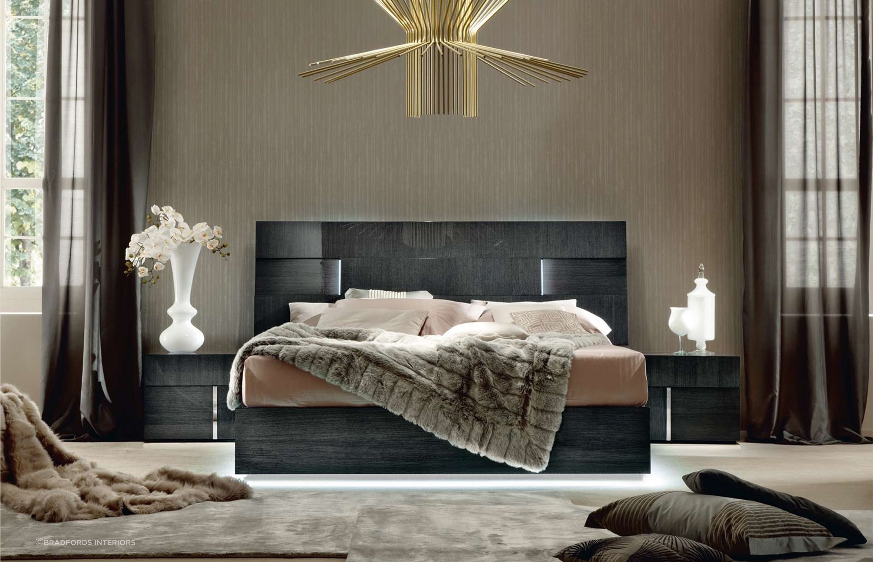 Vibrant lighting brings this bedroom to life with the Montecarlo Bedroom Range by ALF Italia.