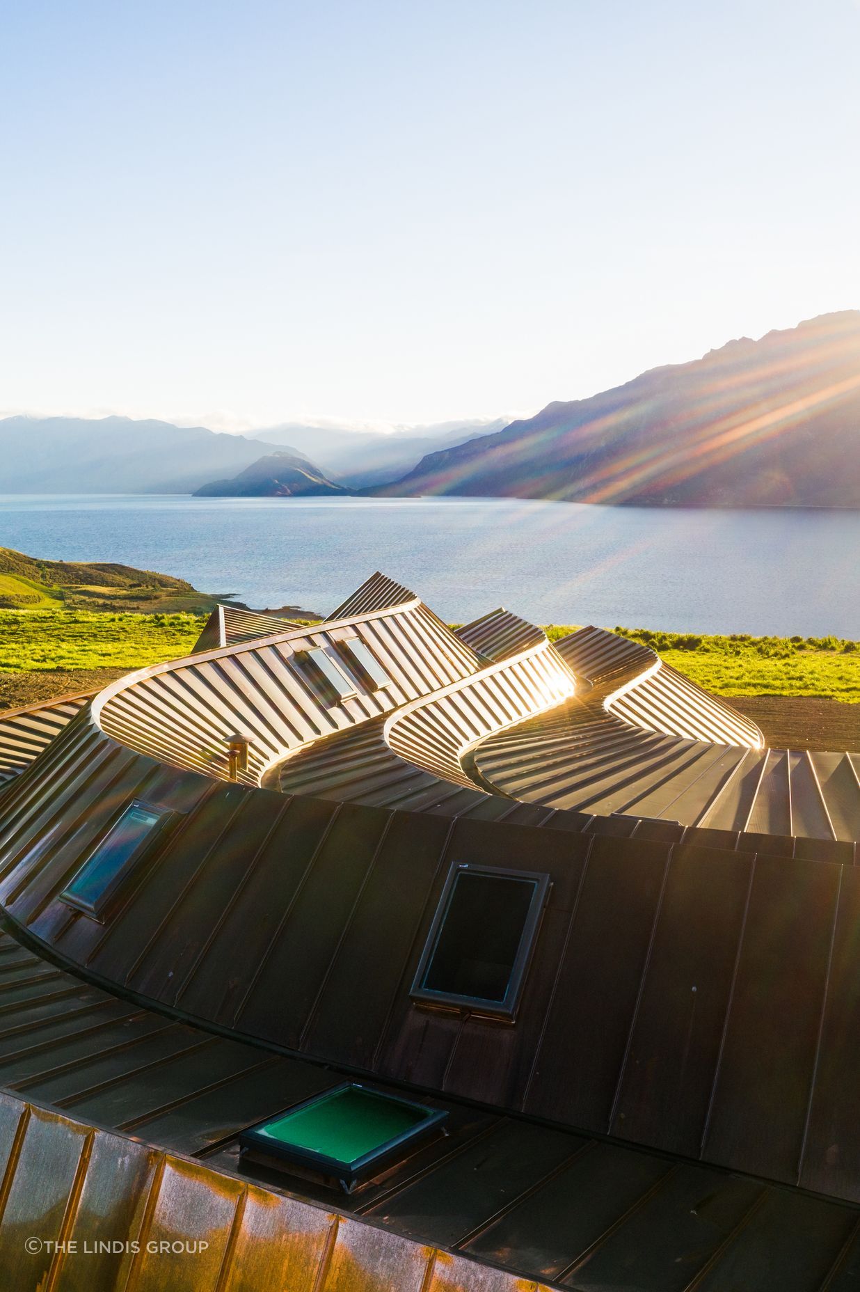 The roof's sculptural form ripples like icing on a cake.