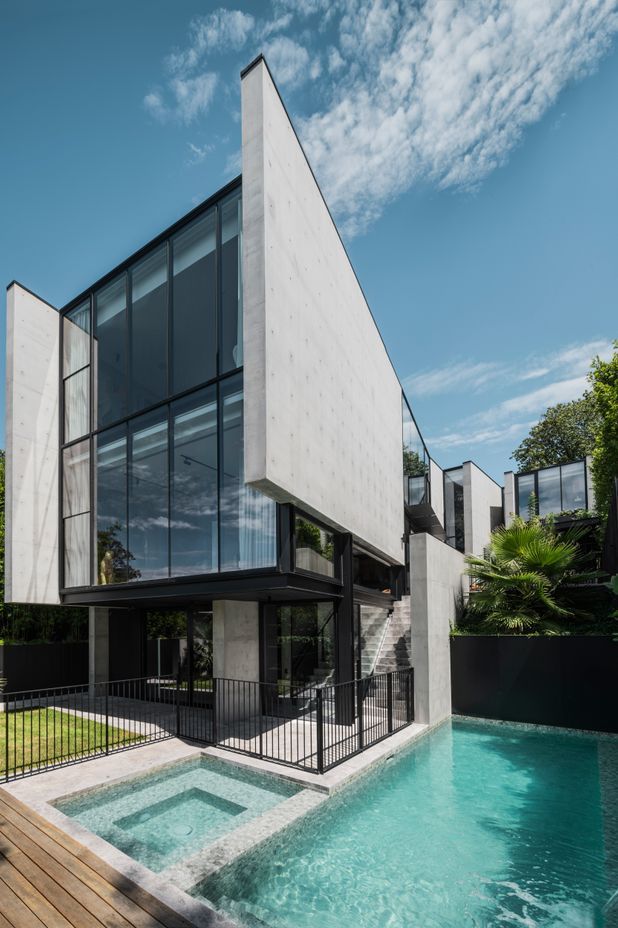 The second and third floors cantilever over the bottom floor.