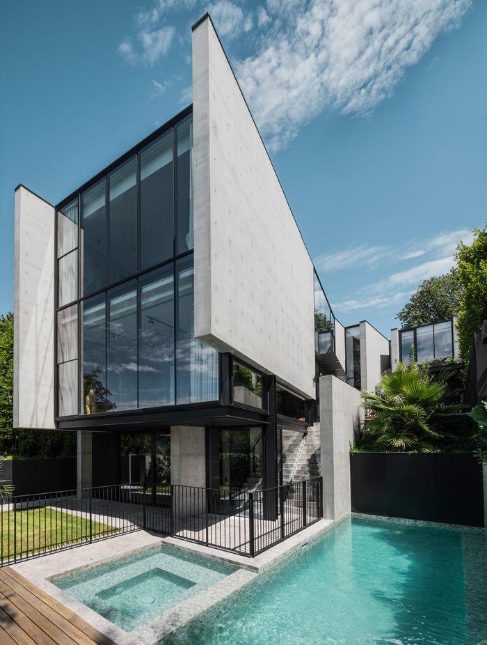 The second and third floors cantilever over the bottom floor.