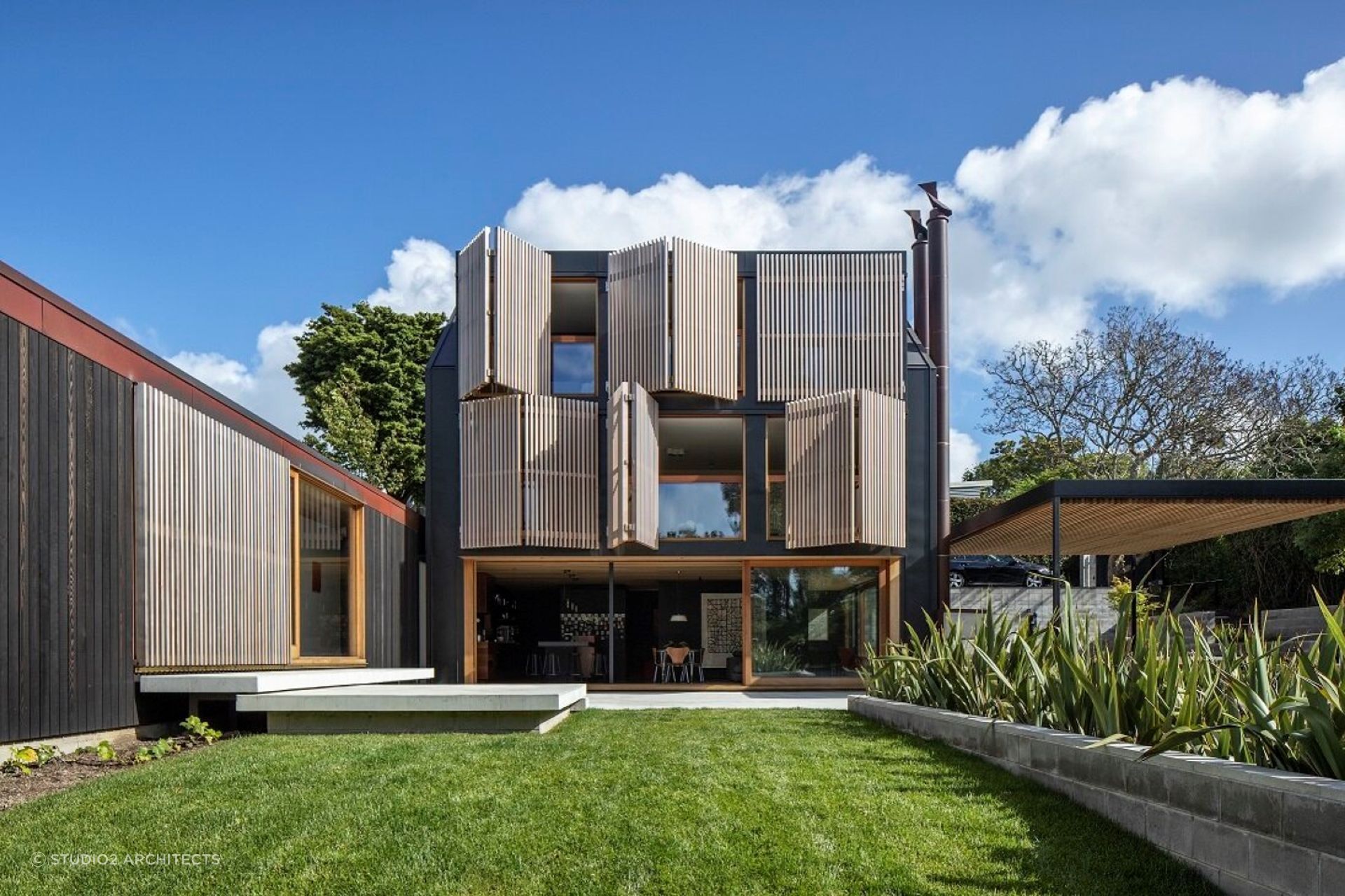 The exquisite shutters provide shade and visual interest to the exterior of the home.