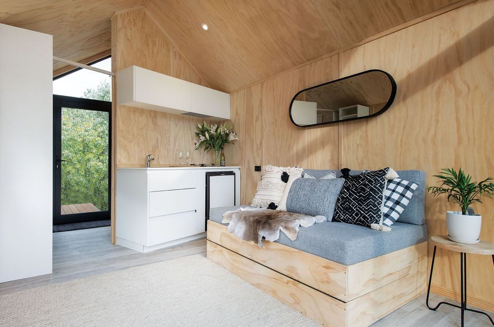 Custom in-built furniture is used to maximise space, complemented by textured furnishings