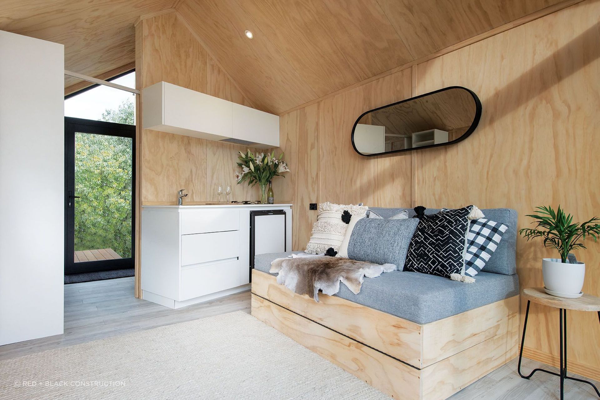Custom in-built furniture is used to maximise space, complemented by textured furnishings