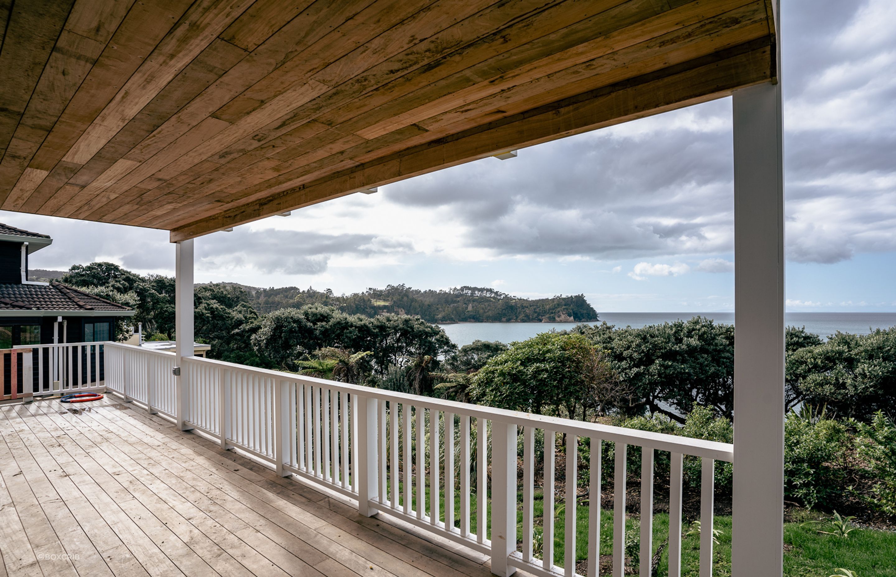 Even the lower level verandah is precisely finished, with the overhang clad in timber, and the balustrade in a Cape Cod style.