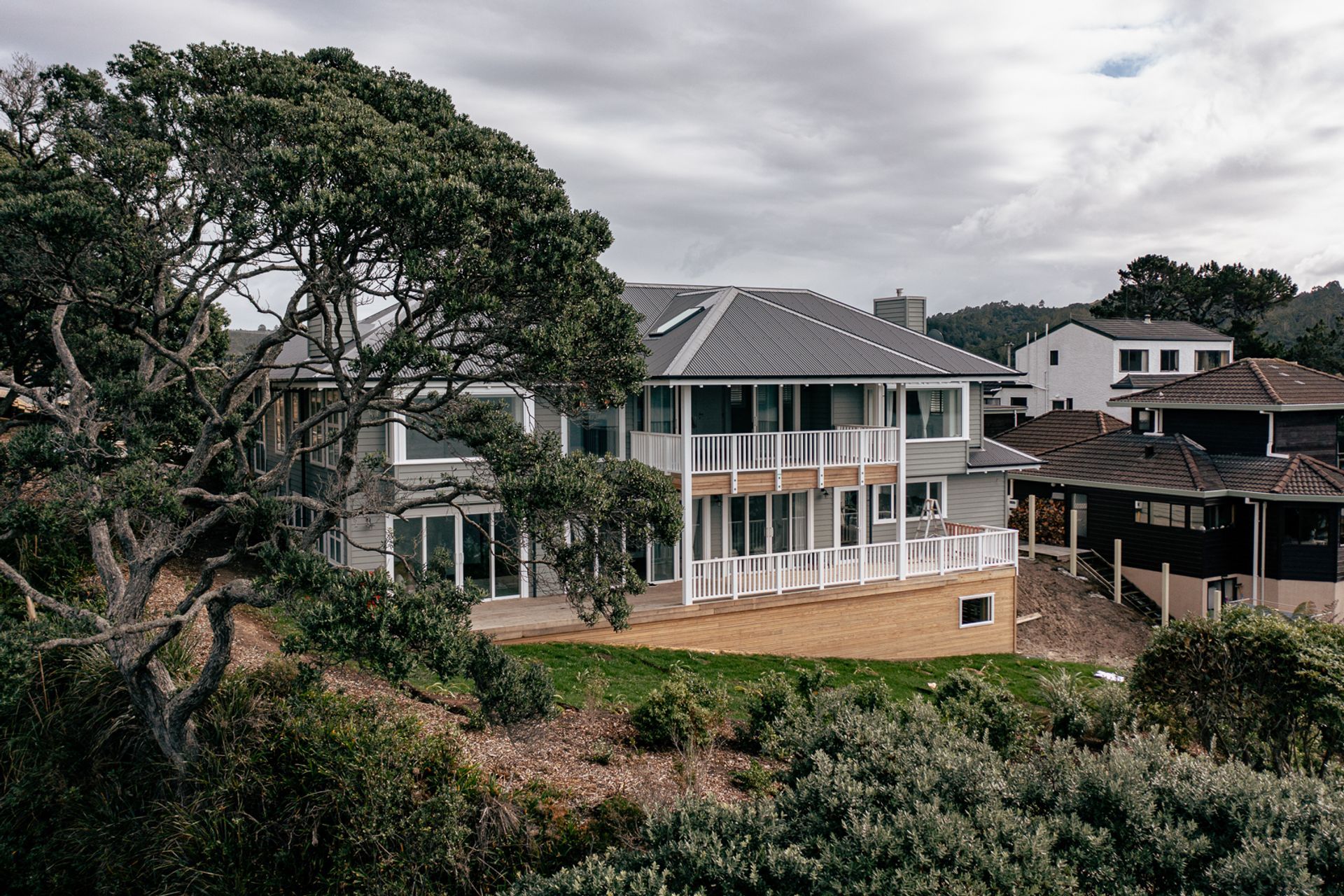 The Cape Cod-style home features a classic symmetry and character detailing.