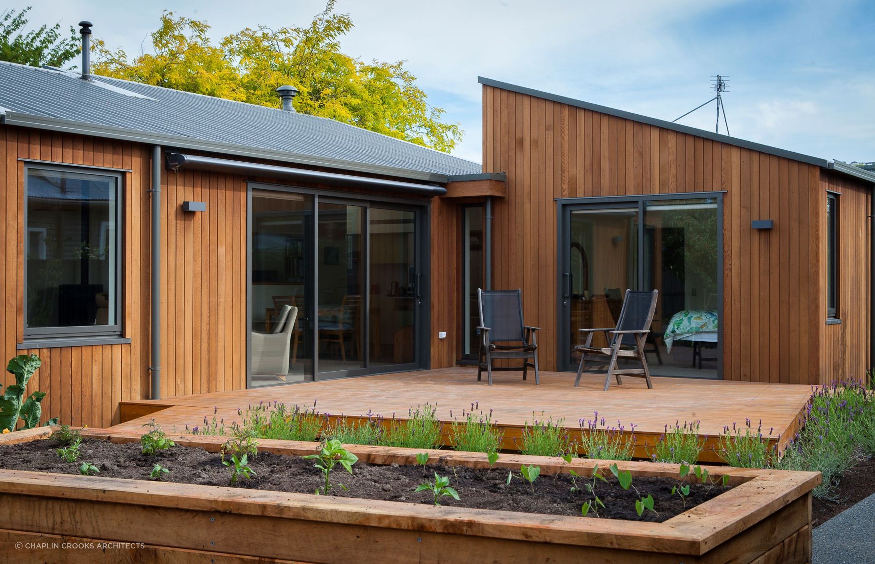 A lovely little deck and garden space awaits for comfortable outdoor living.