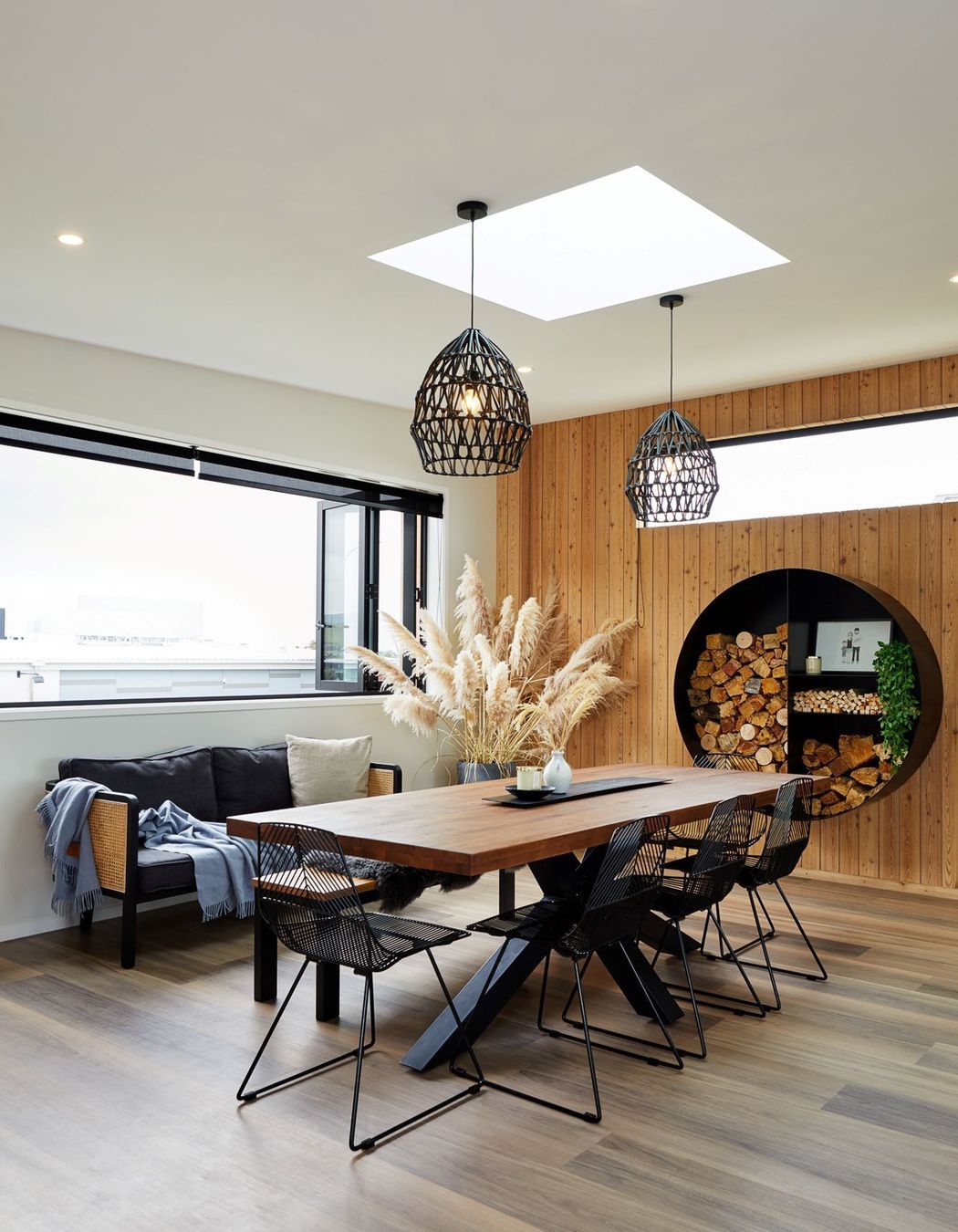 The home's interior timber wall panelling matches the exterior cladding for a cohesive look. | Photography: Amanda Aitken