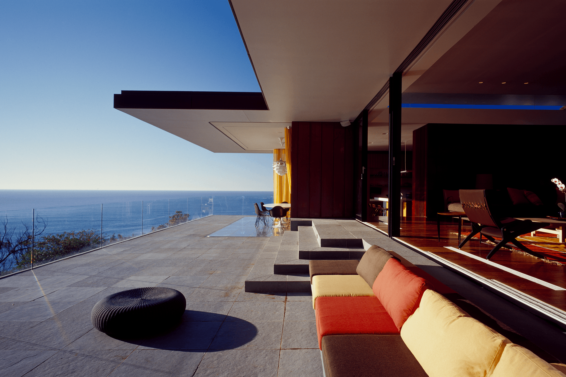 Glazed openings lead out to this incredible balcony offering panoramic 180-degree views. Photography: Brett Boardman.