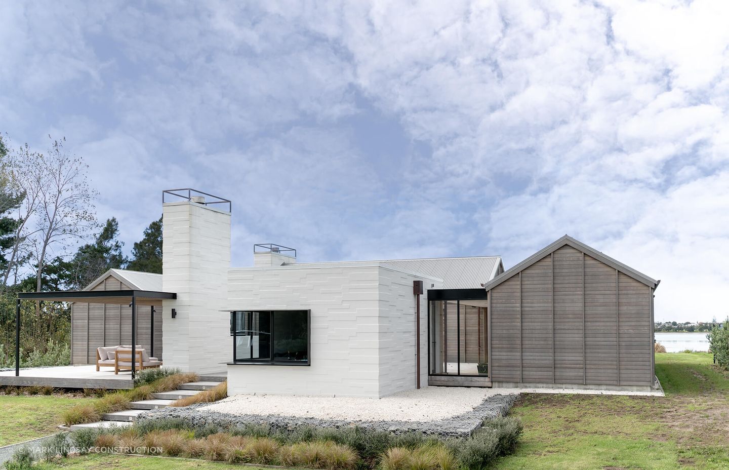 The large white bricks and industrial flashings give the Point Wells House a contemporary edge.