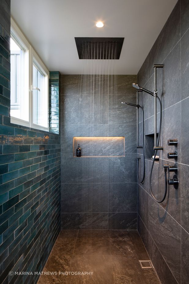 The master bedroom walk-in shower offers a sneak peak to the views through the windows.