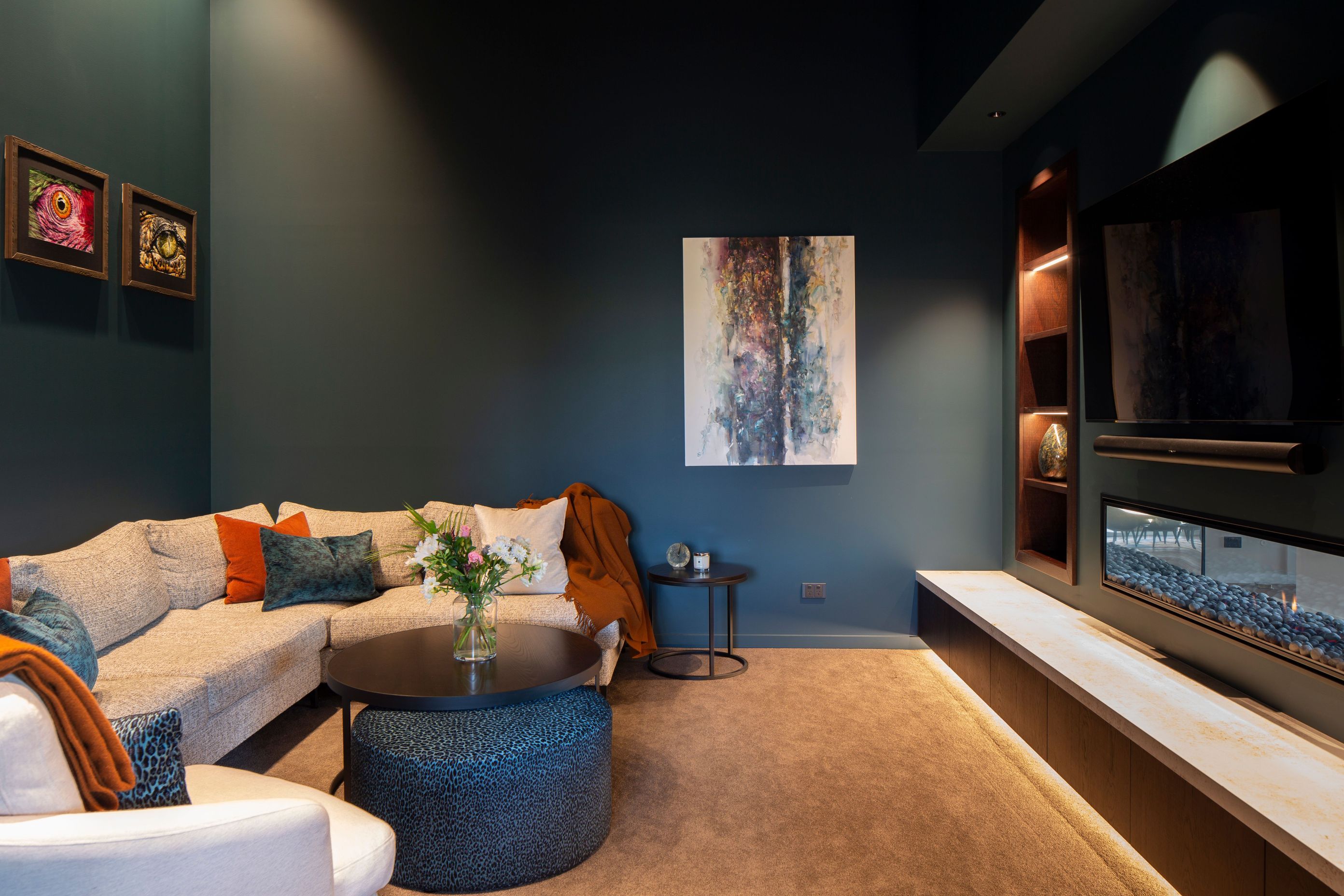 On the other side of the fireplace, the media room is the perfect nook to watch a movie.