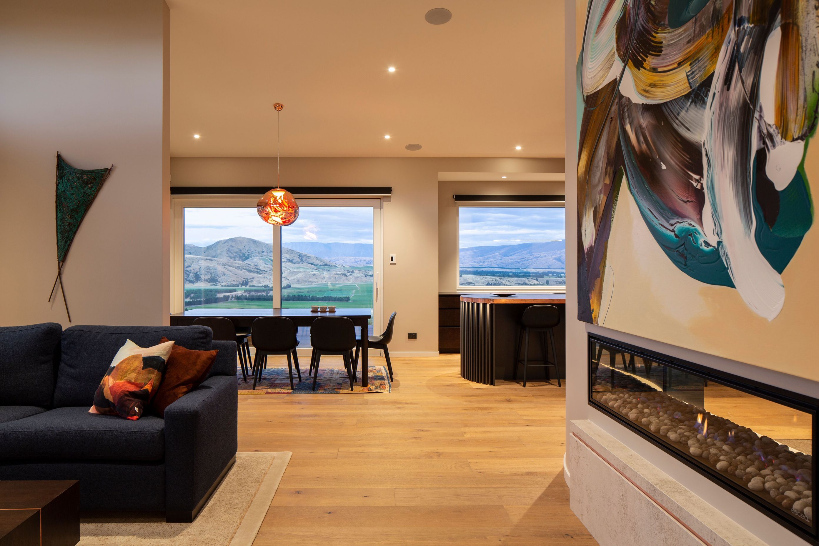On one side of the gas fireplace the lounge offers a cosy retreat.
