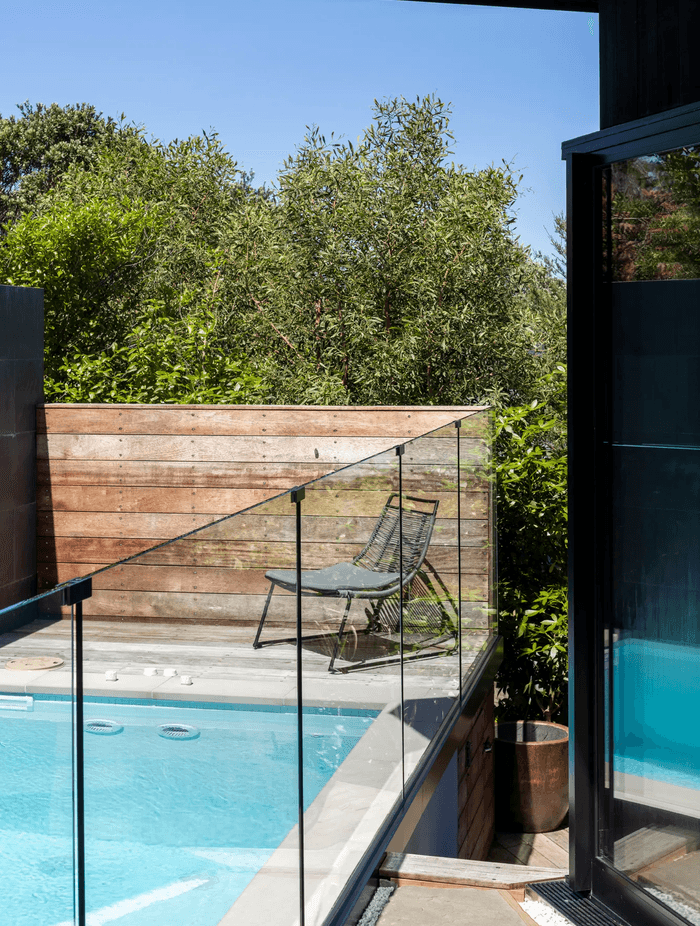 The swimming pool — a sort of bookend to the living room. Described by Jonathan as the home's 'little blue jewel'.