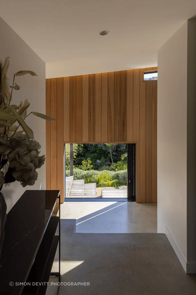 The home’s formal entry offers a direct sightline through to the south garden.