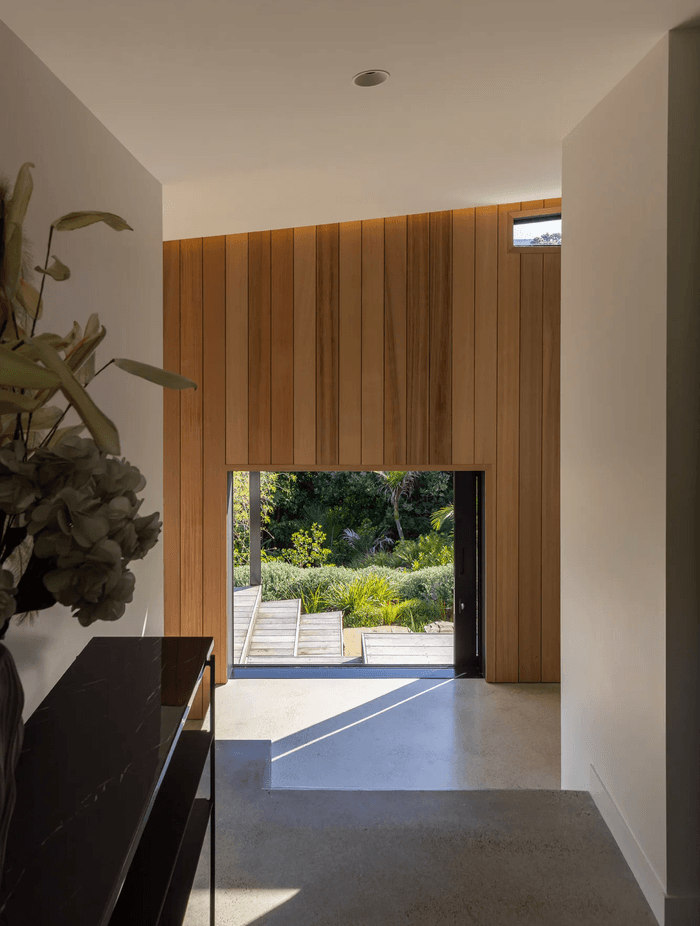 The home’s formal entry offers a direct sightline through to the south garden.