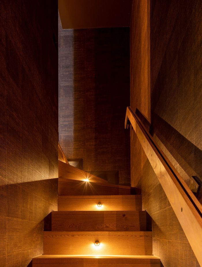 “It’s this little sense of discovery going up the stairs, almost like a hidden piece of the house. There’s dramatic step lighting with a very textured wall covering that then goes up into the media room.”