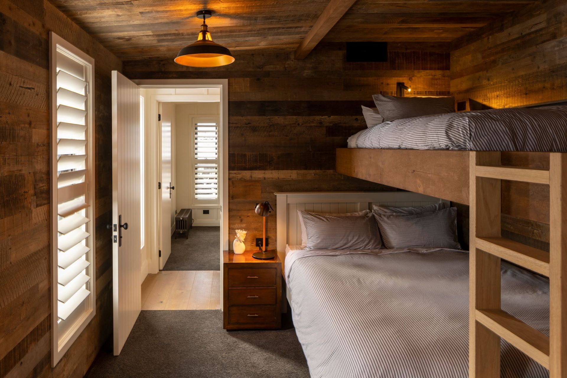 One of two bunk rooms. “The plan was that parents could have children close by but with the run of the bunk room to their heart's delight,” says Vee.