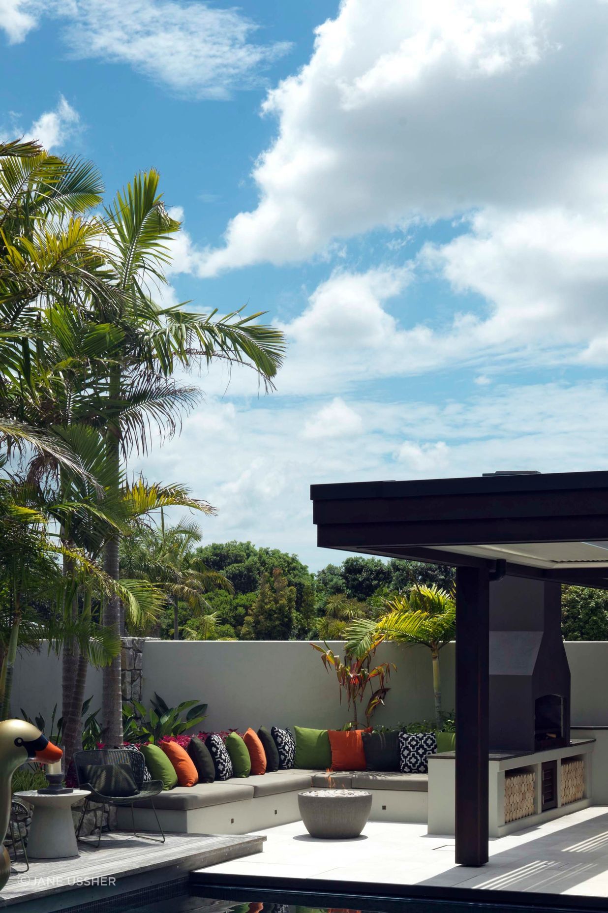 In the entertainment zone, a row of seating centred around a fire pit anticipates a family evening.