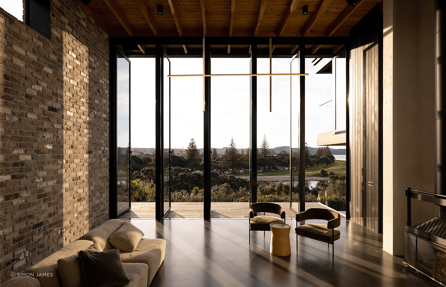 Beautiful recycled bricks feature inside and out of the exquisite Red Beach House — Photography: Jono Parker