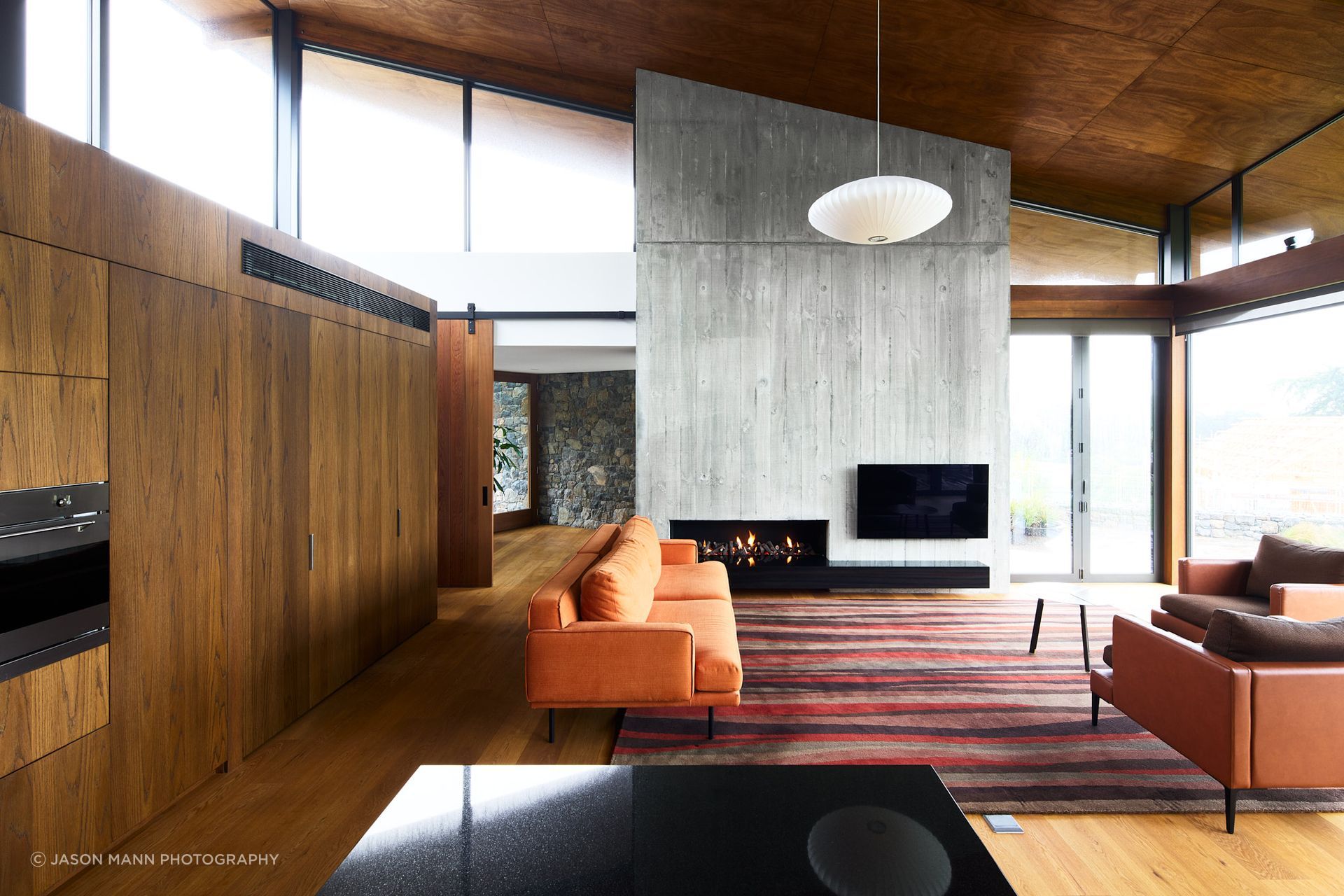 Like a concertina, the ceiling height shifts as the functionality of each space changes. "We tried to get this experience of every space having its own particular character, volume, light, quality of material, and make it a sequence as you move through,” Jasper explains.
