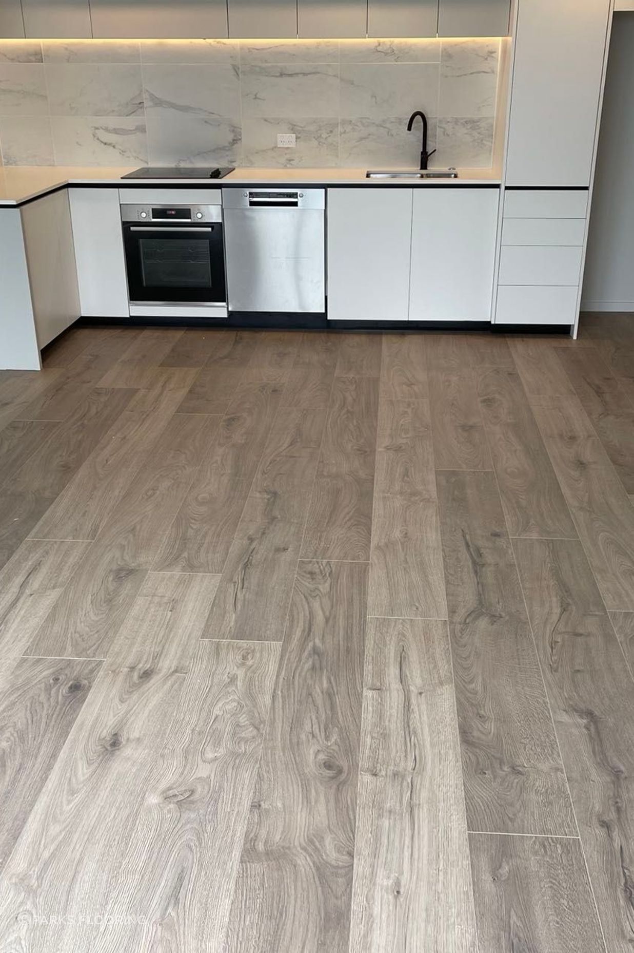 The floor’s subtle, natural colour complements the neutral palette of the Risland units, making it easy for residents to add their own flair to the space.