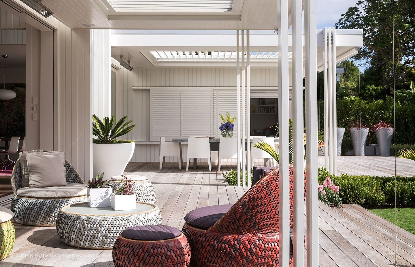 The rear addition seamlessly flows into a comfortable outdoor living space.