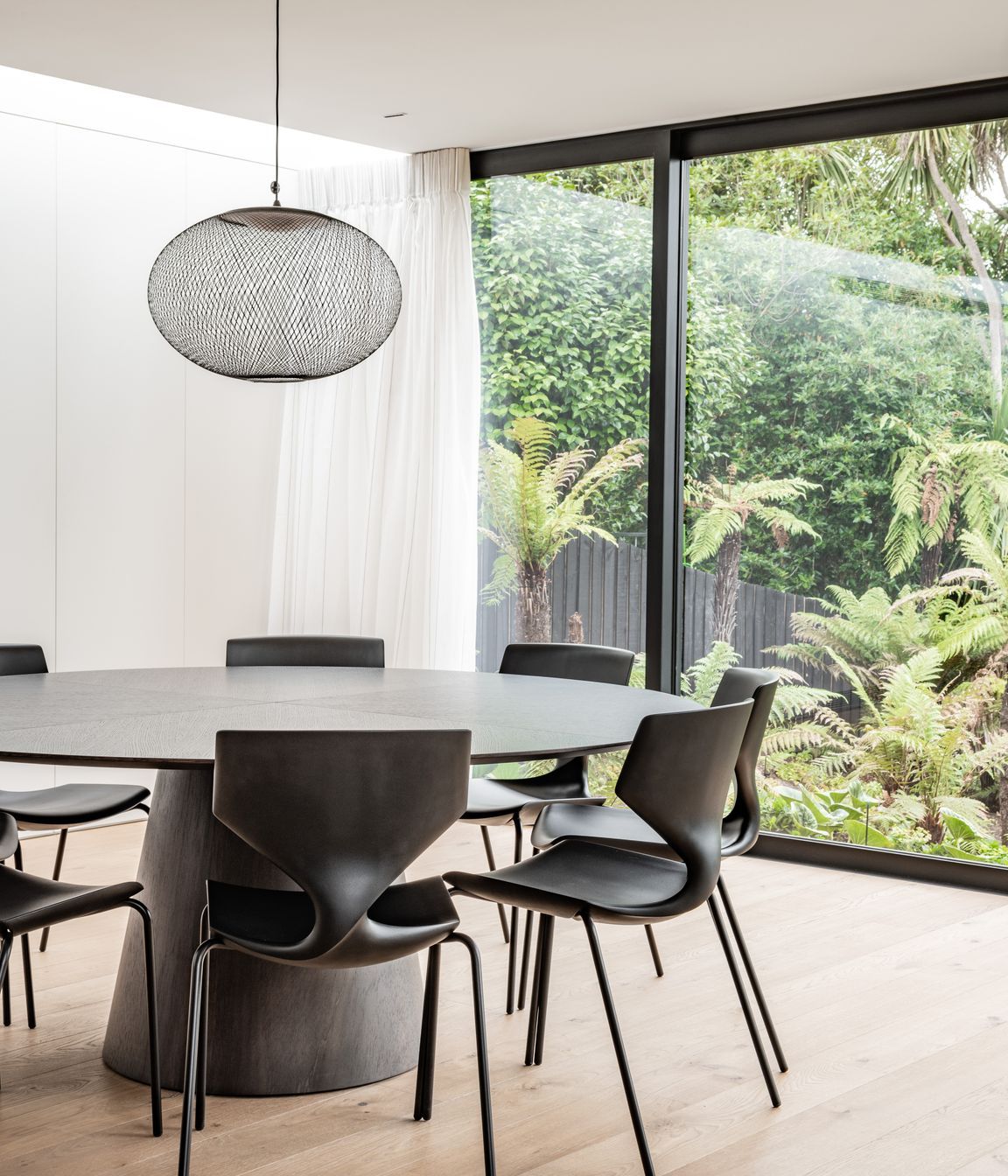 The dining area connects to the outdoors with a view to the stream at the bottom of the garden. “The key motivator is all about filling the house with light, because it hasn't got that direct northern orientation.”