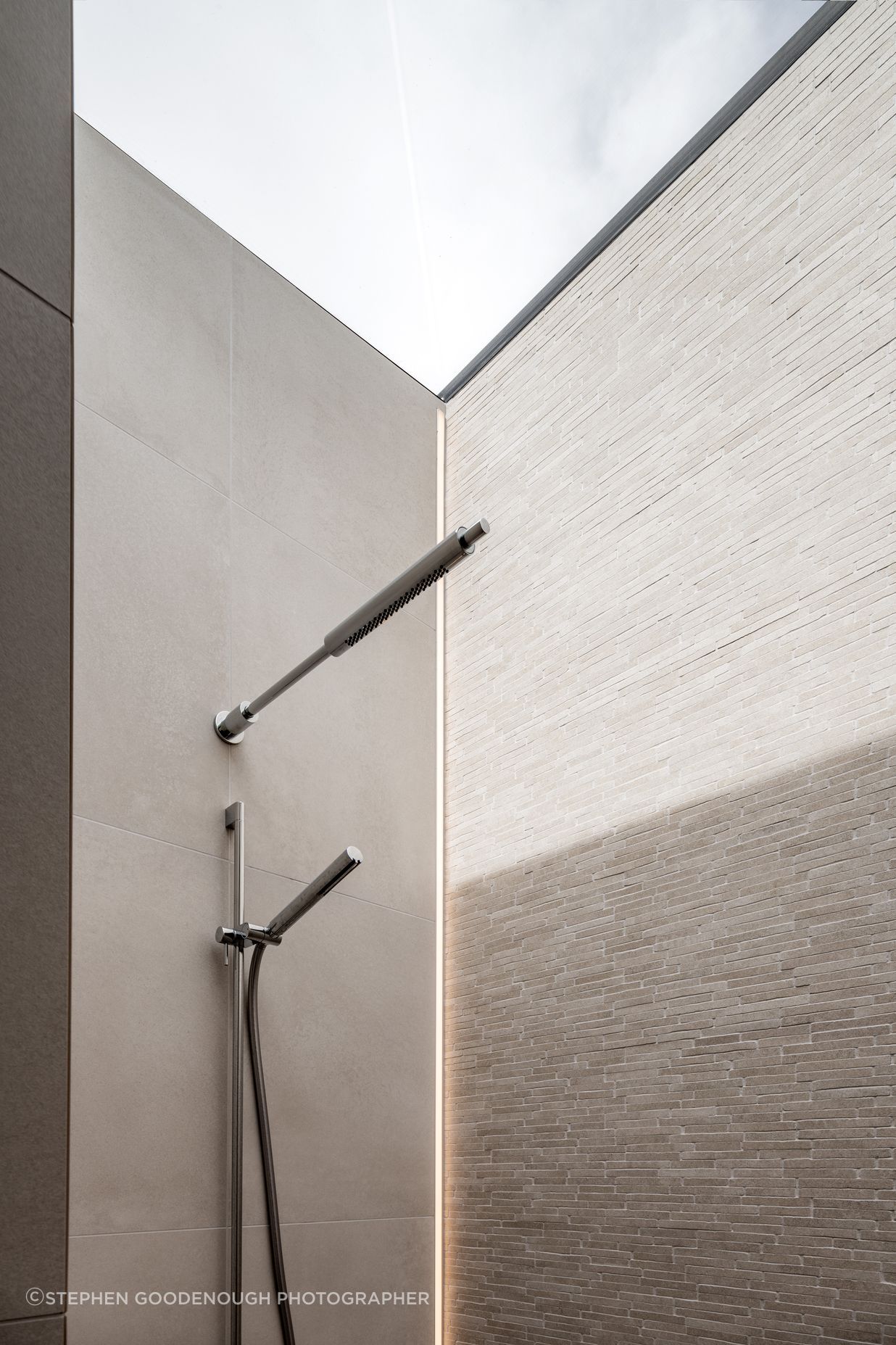 The shower had a skylight over the entire thing so there was nowhere to put a light. We actually recessed an LED strip vertically into the tile.”