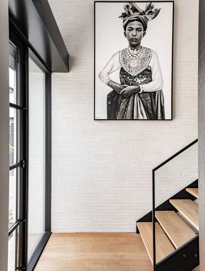 In the entrance, the warmth and texture of the custom made Canterbury Clay Bricks is carried through from the exterior. Tobin says he specified quite a thin profile at the request of the client.