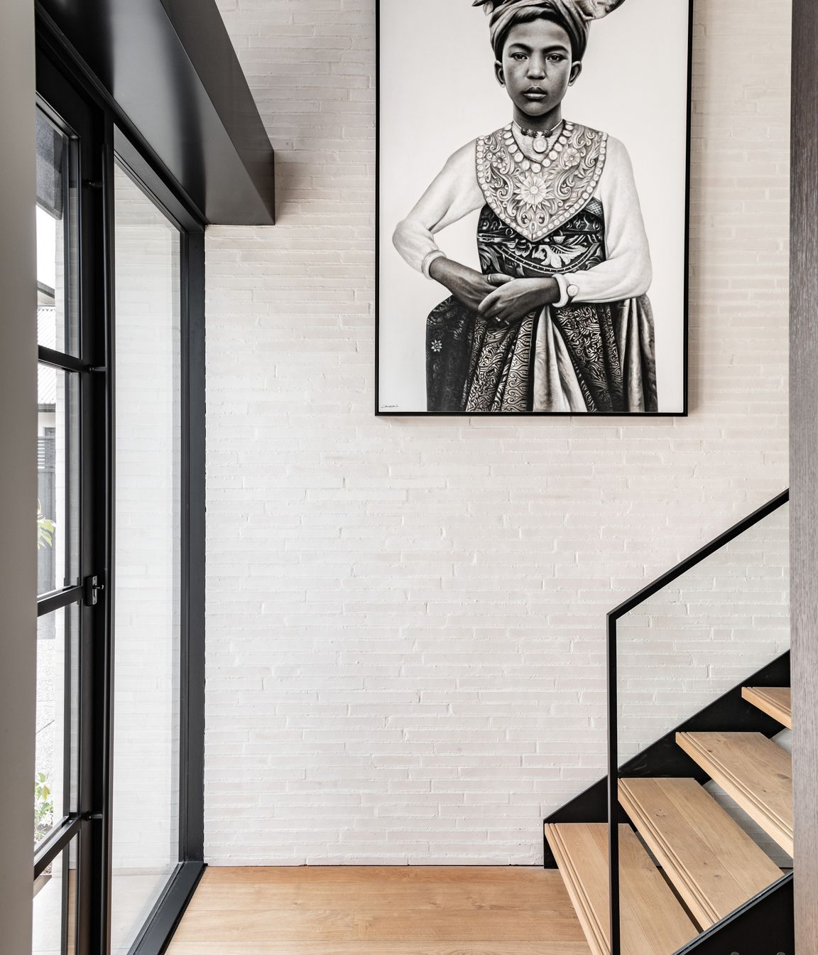 In the entrance, the warmth and texture of the custom made Canterbury Clay Bricks is carried through from the exterior. Tobin says he specified quite a thin profile at the request of the client.