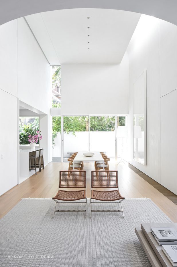 The new kitchen is tucked to the side of the double-height volume open-plan living space.