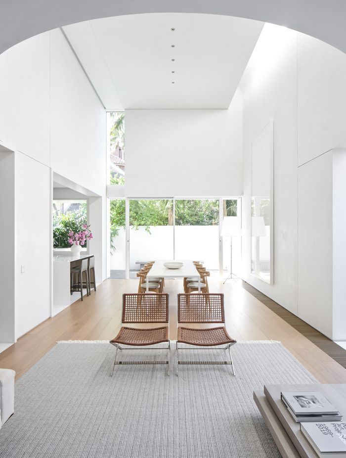 The new kitchen is tucked to the side of the double-height volume open-plan living space.