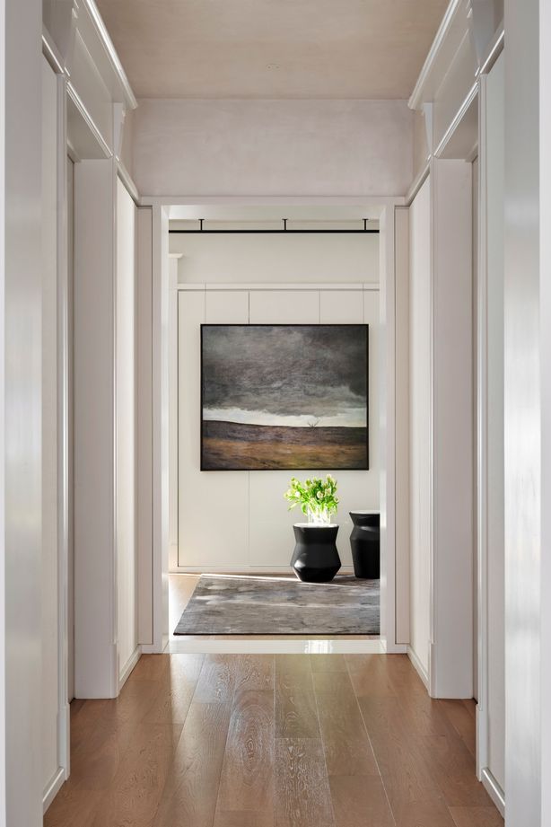 Oak floorboards create continuity throughout.