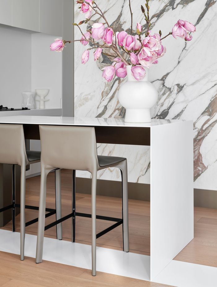 The kitchen bar is cleverly designed to hide its storage.