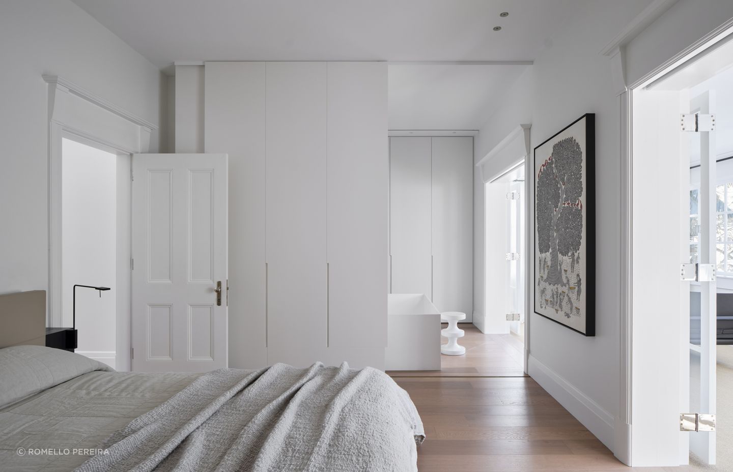 The master suite transitions to a pale and serene ensuite with freestanding bath.