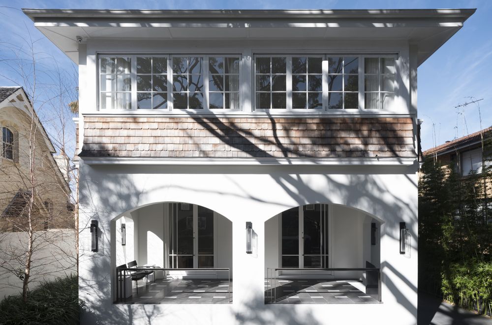 The original Arts &amp; Crafts exterior and enclosed veranda were retained.