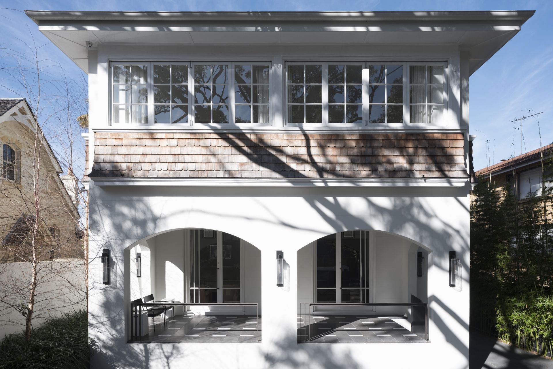 The original Arts & Crafts exterior and enclosed veranda were retained.