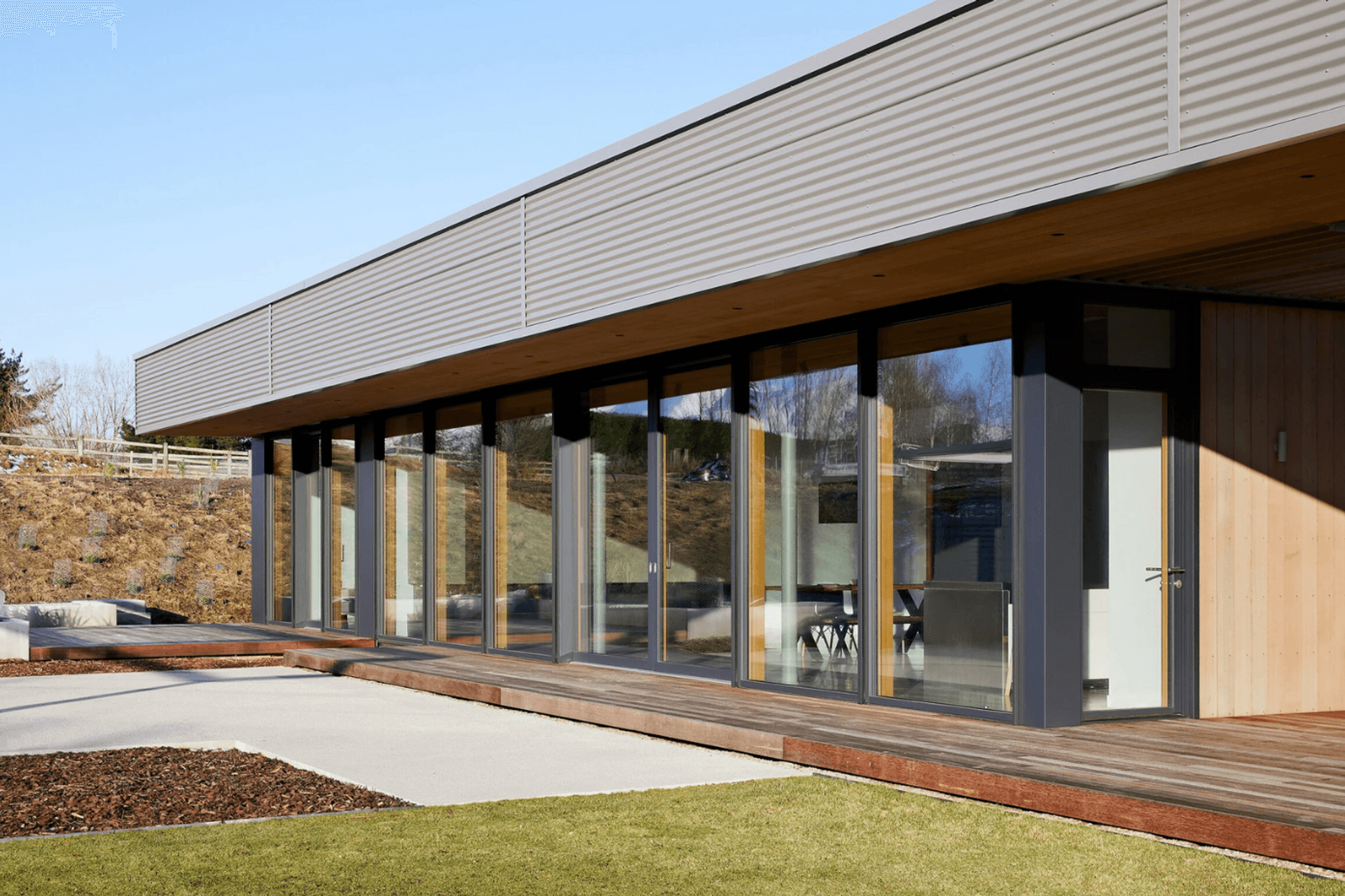 Light pours in from a wall of glass to the north.