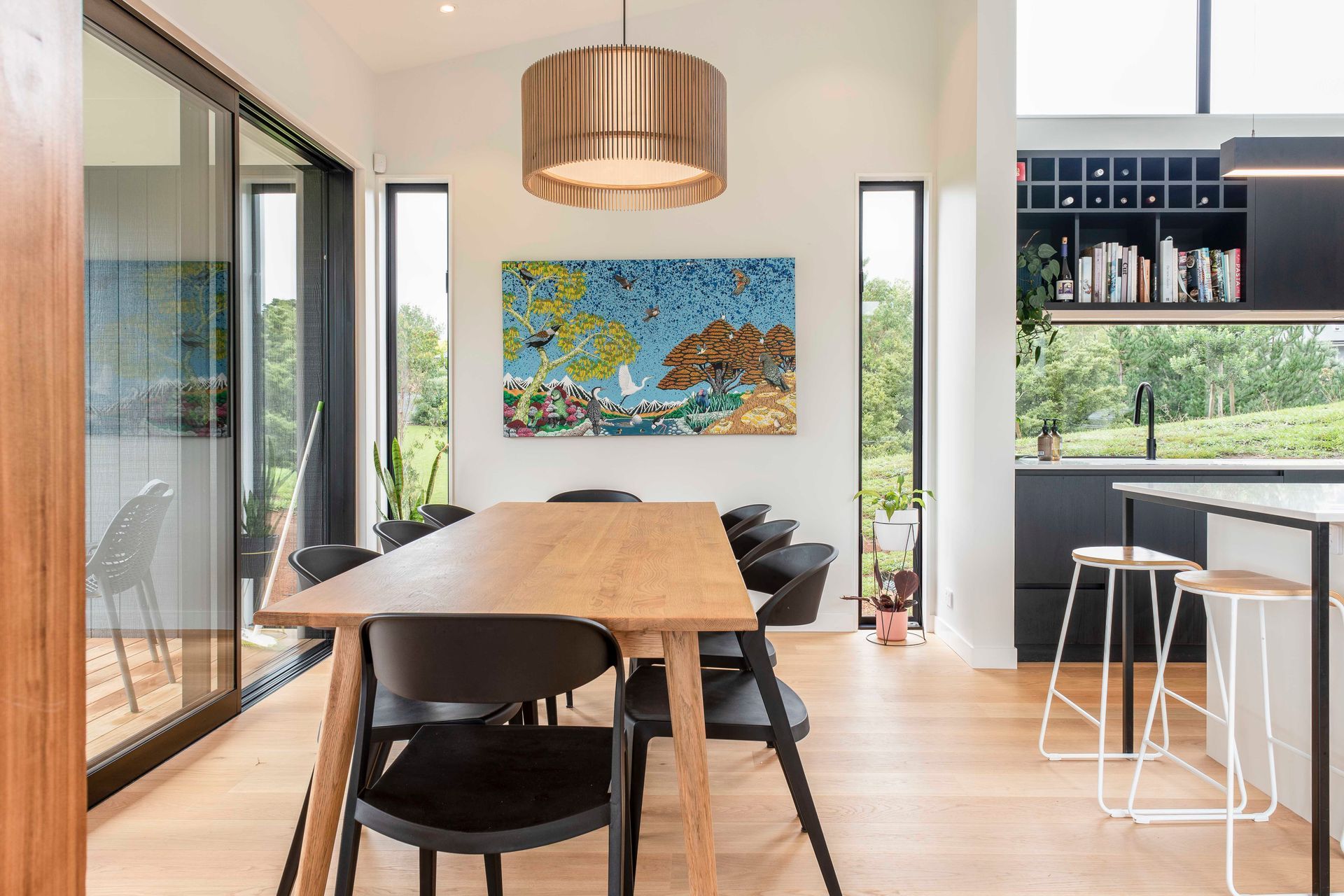 Slot windows provide peaks out to the native bush, and drench the living space with light.