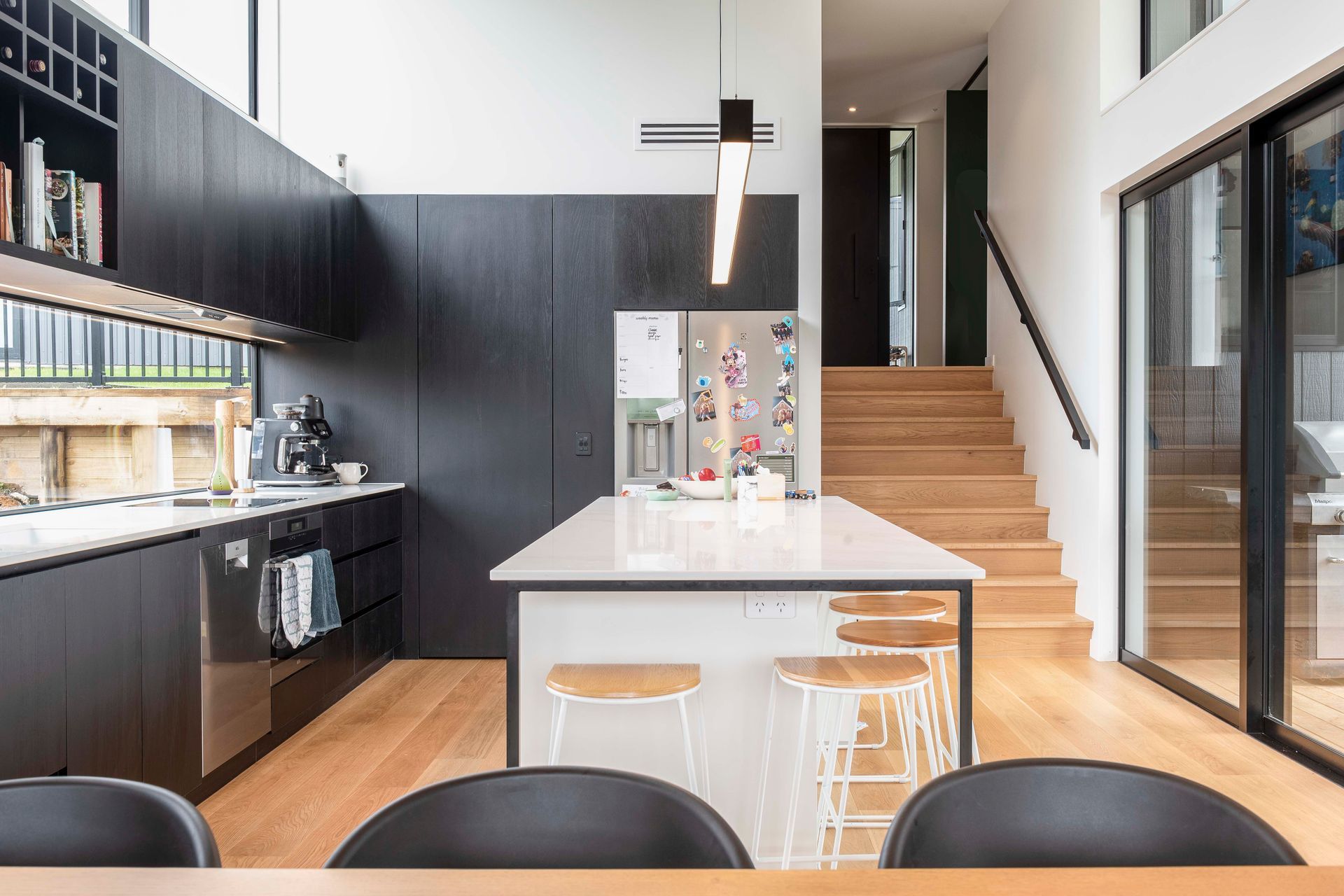 The 4.2m stud height in the kitchen/dining space gives the modest home a voluminous and open feel.