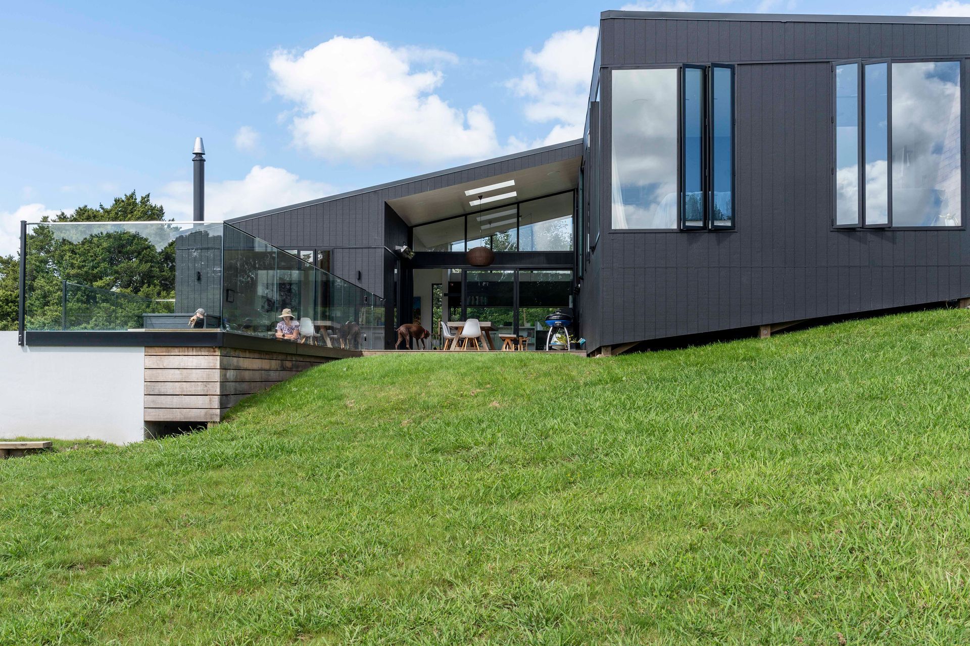 The contour of the land dictated a house formed in split-levels that beds into the hillside.