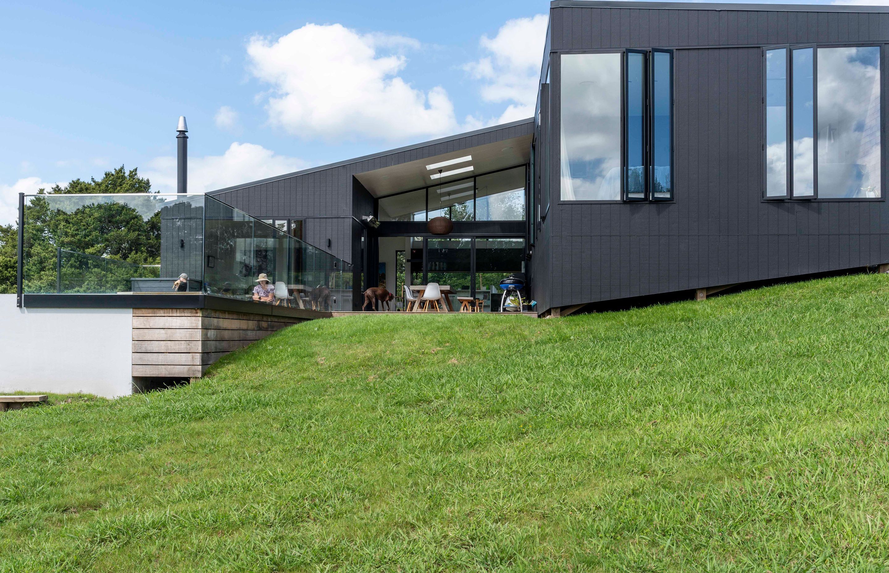 The contour of the land dictated a house formed in split-levels that beds into the hillside.
